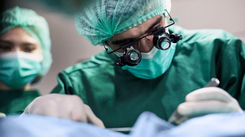 Surgeon working with magnifying loupes